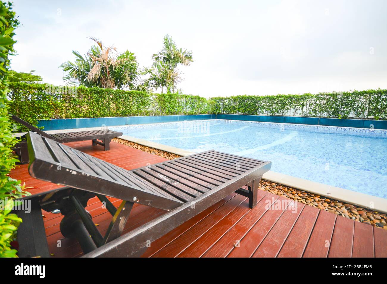 wooden pool bed at the swimming pool Stock Photo Alamy