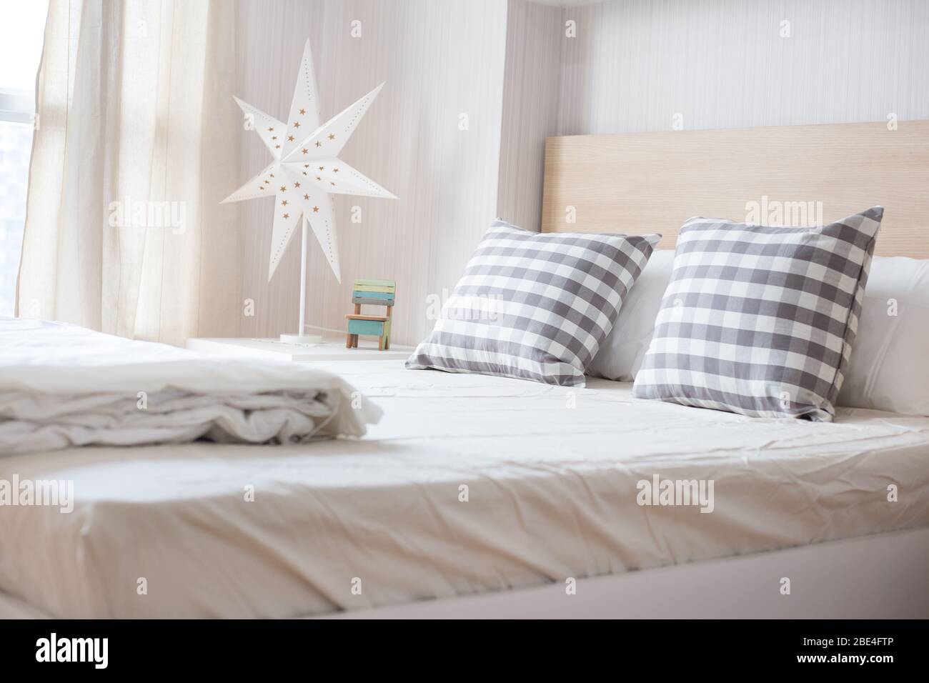 Luxury pillows on white bed in bedroom Stock Photo Alamy