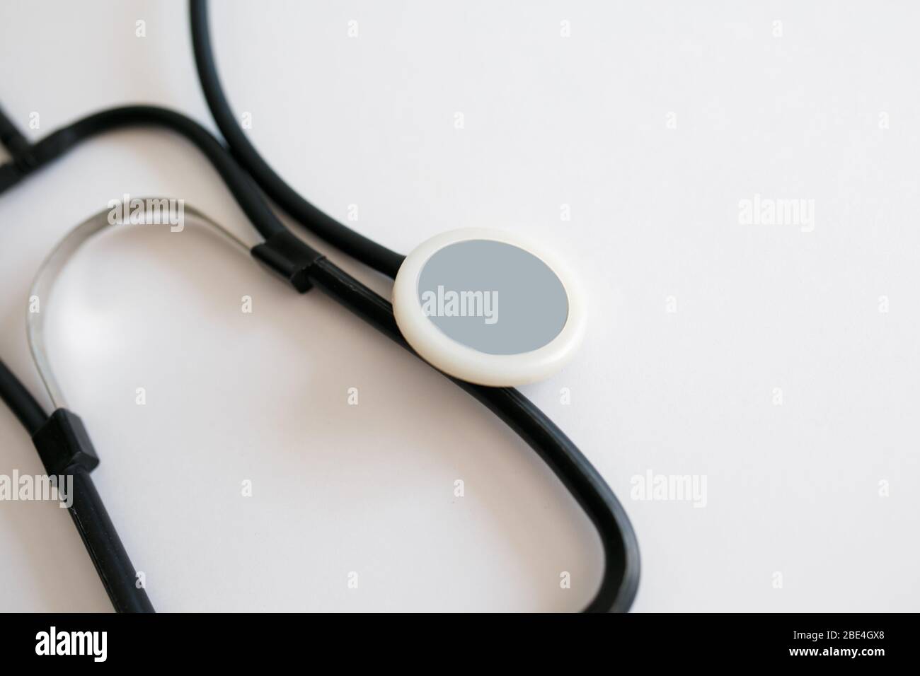 Black stethoscope isolated on white background. Healthcare Stock Photo ...