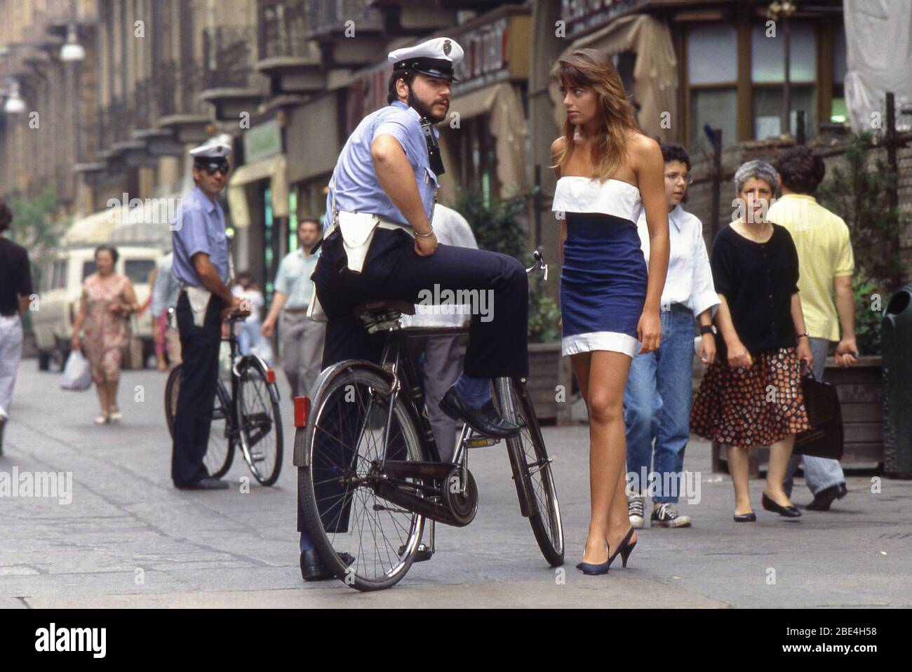 Turin, Italy - September 1988: Asking for informations to an officer in via Garibaldi. Stock Photo