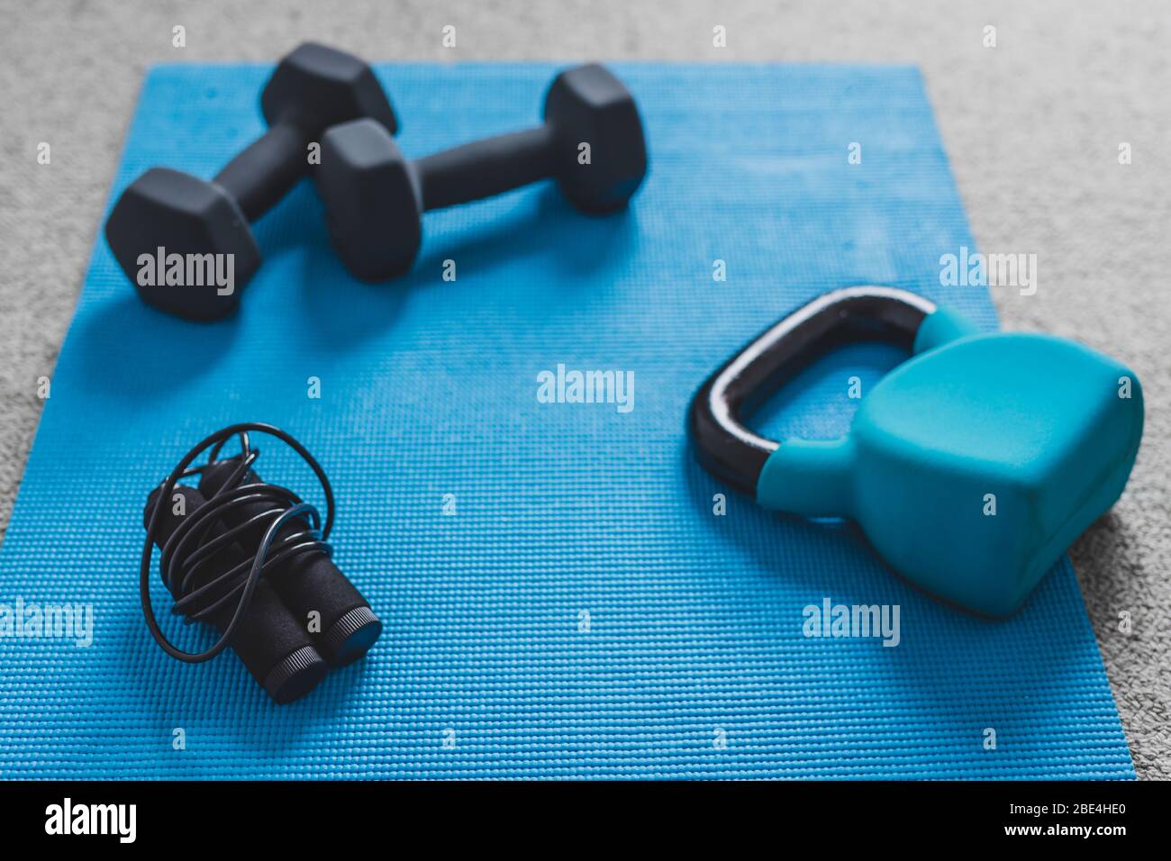 home gym concept, room with dumbbells kettlebell foam roller and push