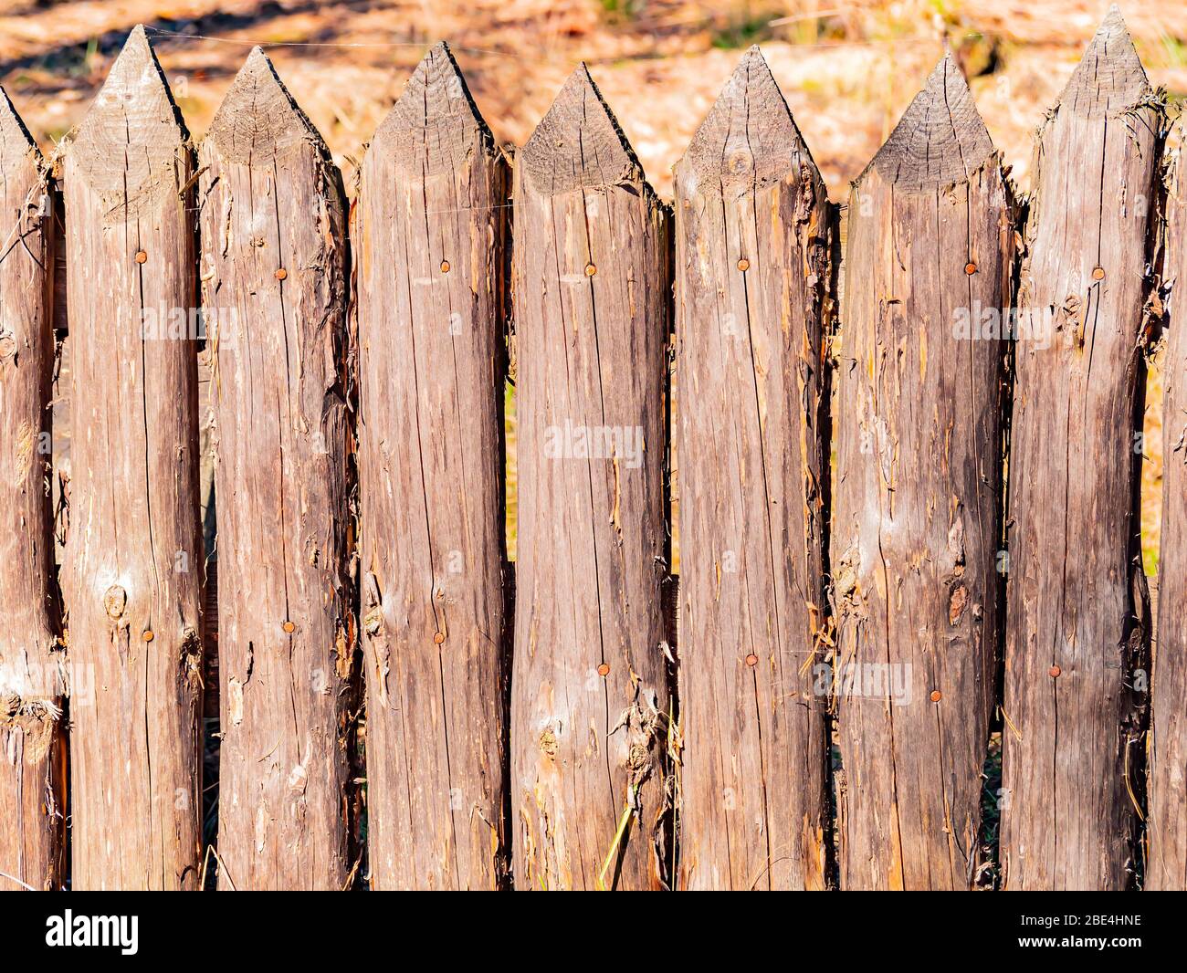 Background image of a wooden fence picket fence Stock Photo - Alamy