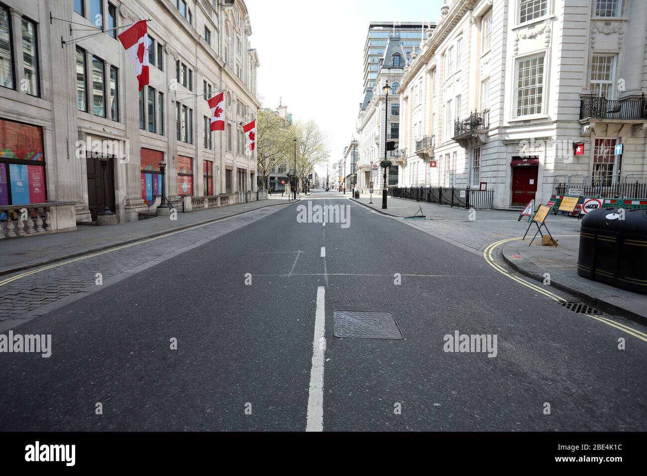 London, UK. 11th Apr, 2020. Day Nineteen of Lockdown in London. Pall Mall is very quiet on Easter Saturday. It is the first public holiday of the year, and many people enjoy the long weekend by going out and about or on holiday, but this year the country is on lockdown due to the COVID-19 Coronavirus pandemic. People are not allowed to leave home except for minimal food shopping, medical treatment, exercise - once a day, and essential work. COVID-19 Coronavirus lockdown, London, UK, on April 11, 2020 Credit: Paul Marriott/Alamy Live News Stock Photo