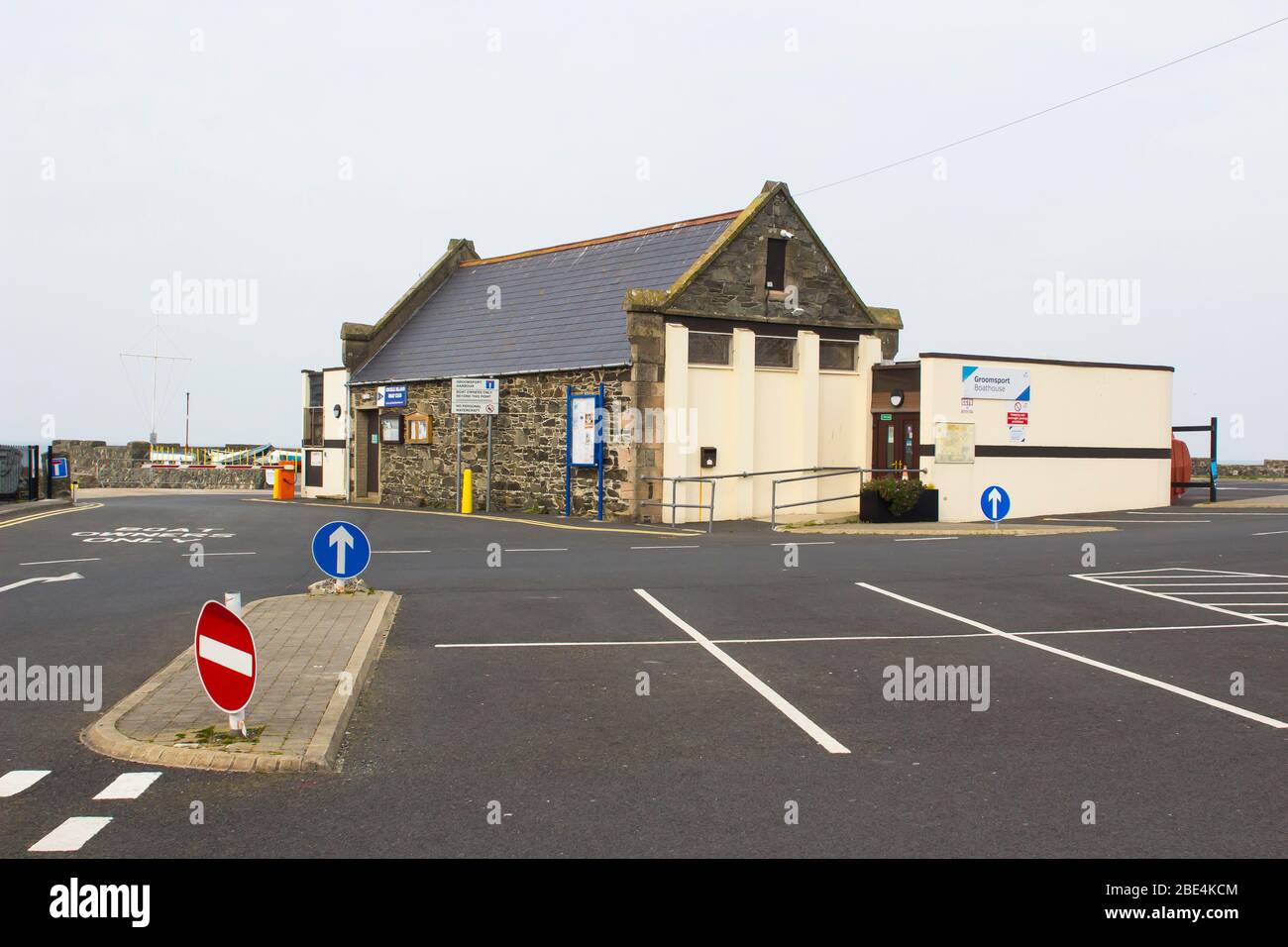 11 April 2020 The stone built Boathouse and Harbour Office at Groomsport Harbour in County Down Northern Ireland shut up during the Covid 19 lockdown Stock Photo