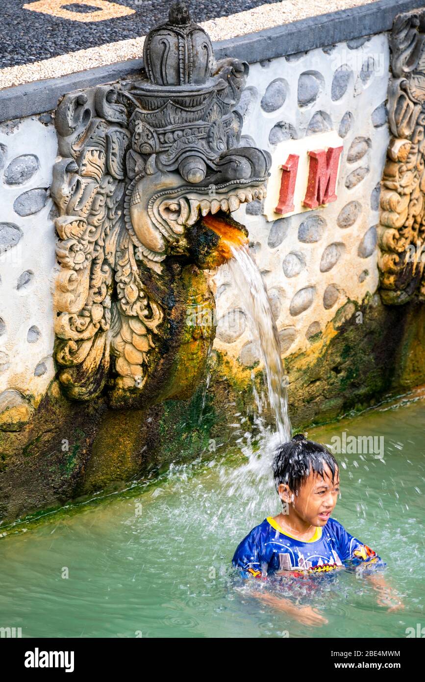 Vertical portrait of a young boy at the Banjar hot Springs in Bali, Indonesia. Stock Photo