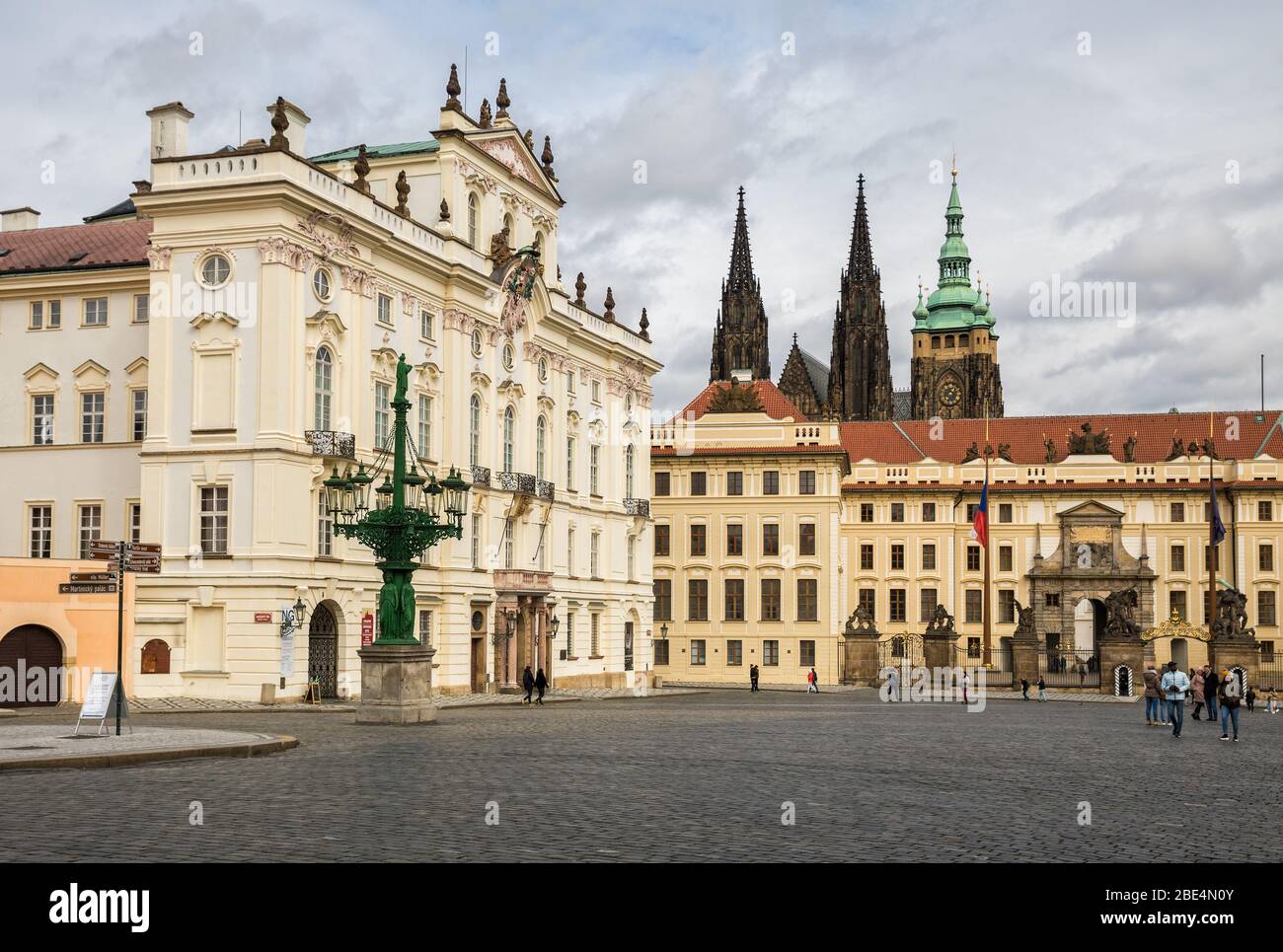 PRAGUE, CZECH REPUBLIC - MARCH 10, 2020: Hradcanske Square, the Archbishop Palace and Prague Castle. Tourists visit attractions Stock Photo