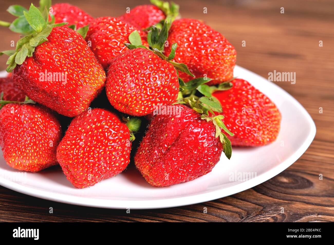 Bowl delicious large strawberries hi-res stock photography and images ...