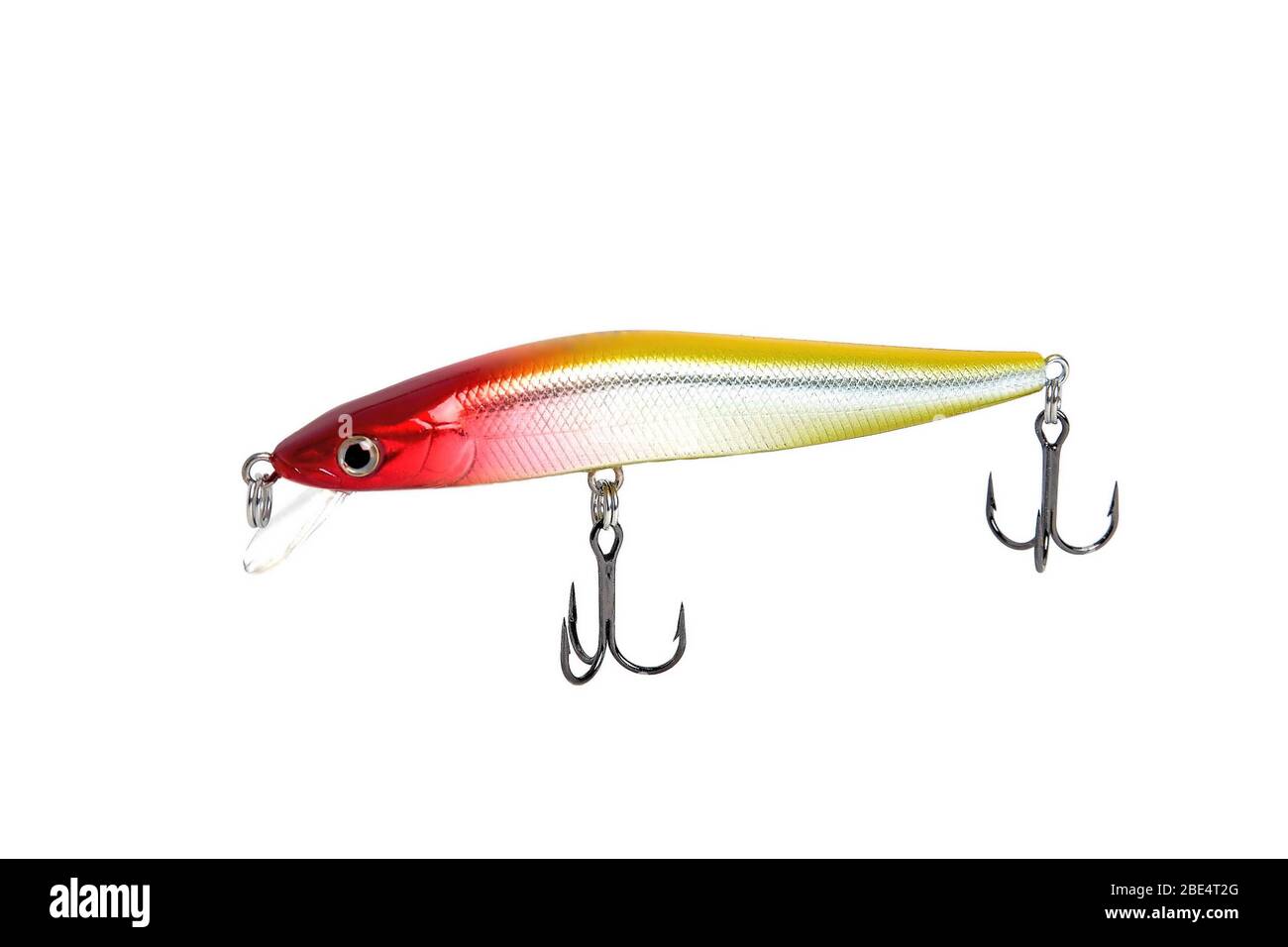 Fishing wobbler with red head, yellow back and white belly. Close-up on a white background. Stock Photo