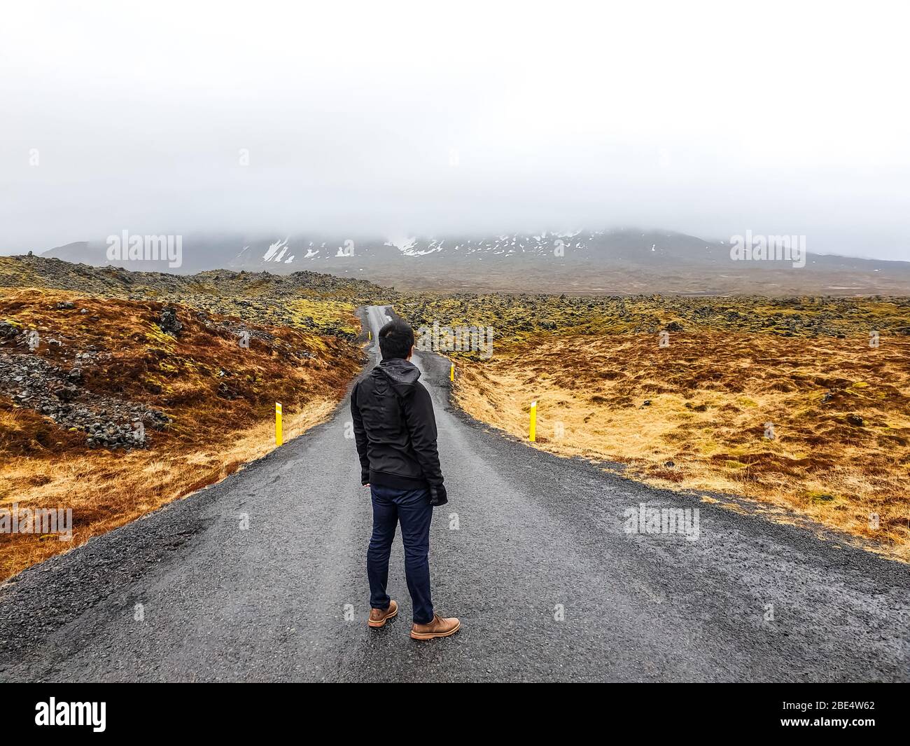A traveler admiring the Icelandic landscape Stock Photo