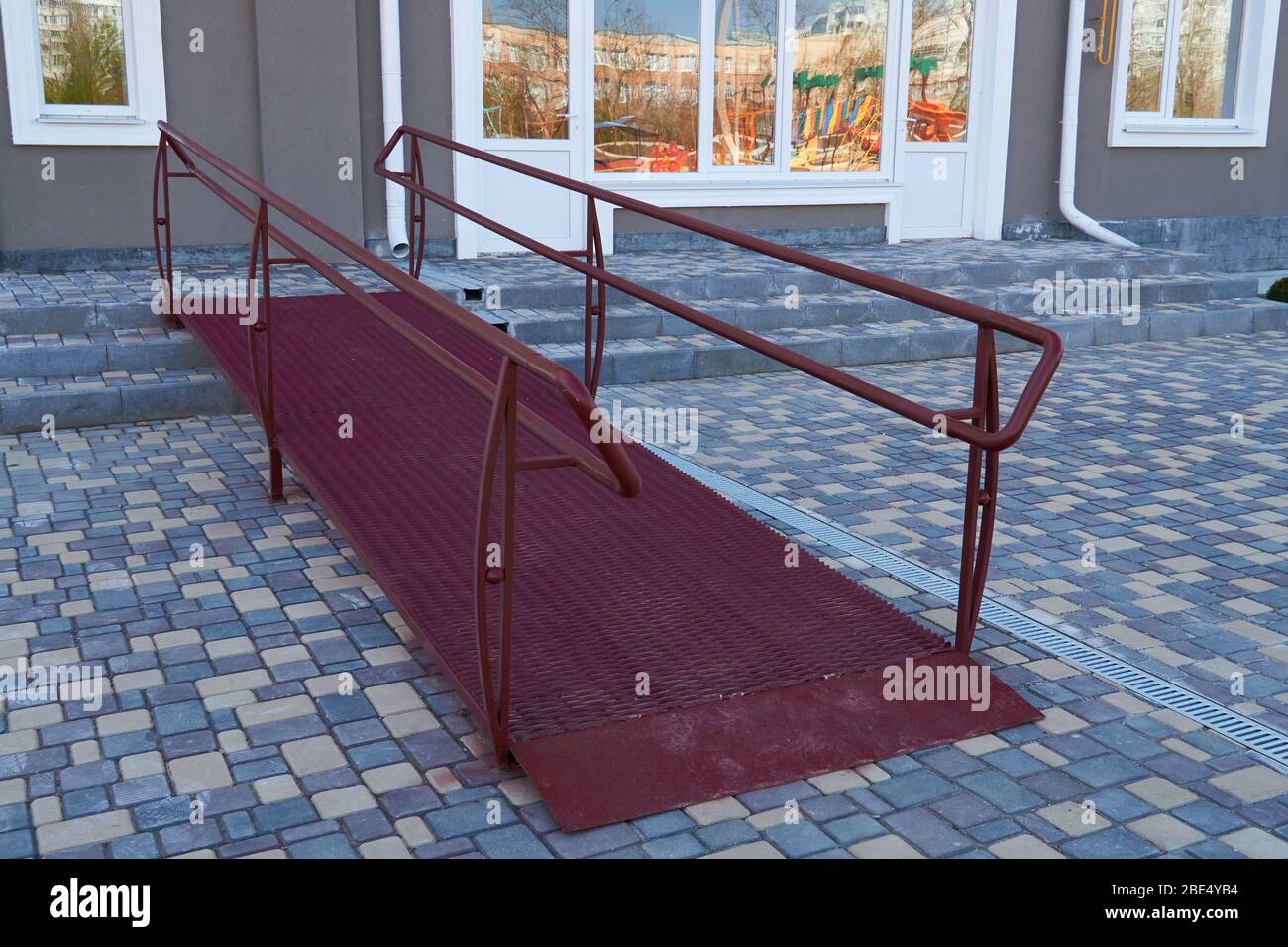 Wheelchair access ramp for entrance of residential multistory building
