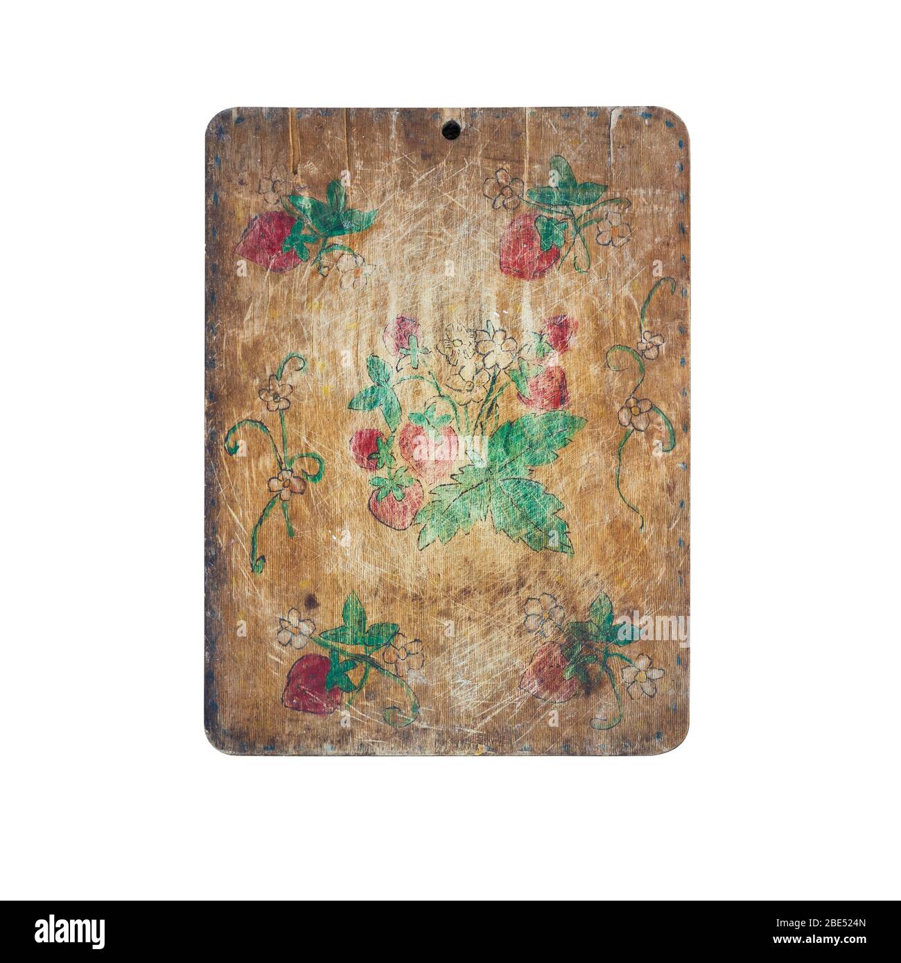 Old wooden kitchen cutting board decorated with children pattern Stock Photo