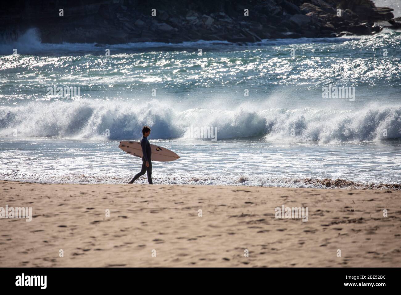 COVID 19 Sydney, australian surfers getting their daily exercise at the beach during coronavirus lockdown in Australia Stock Photo