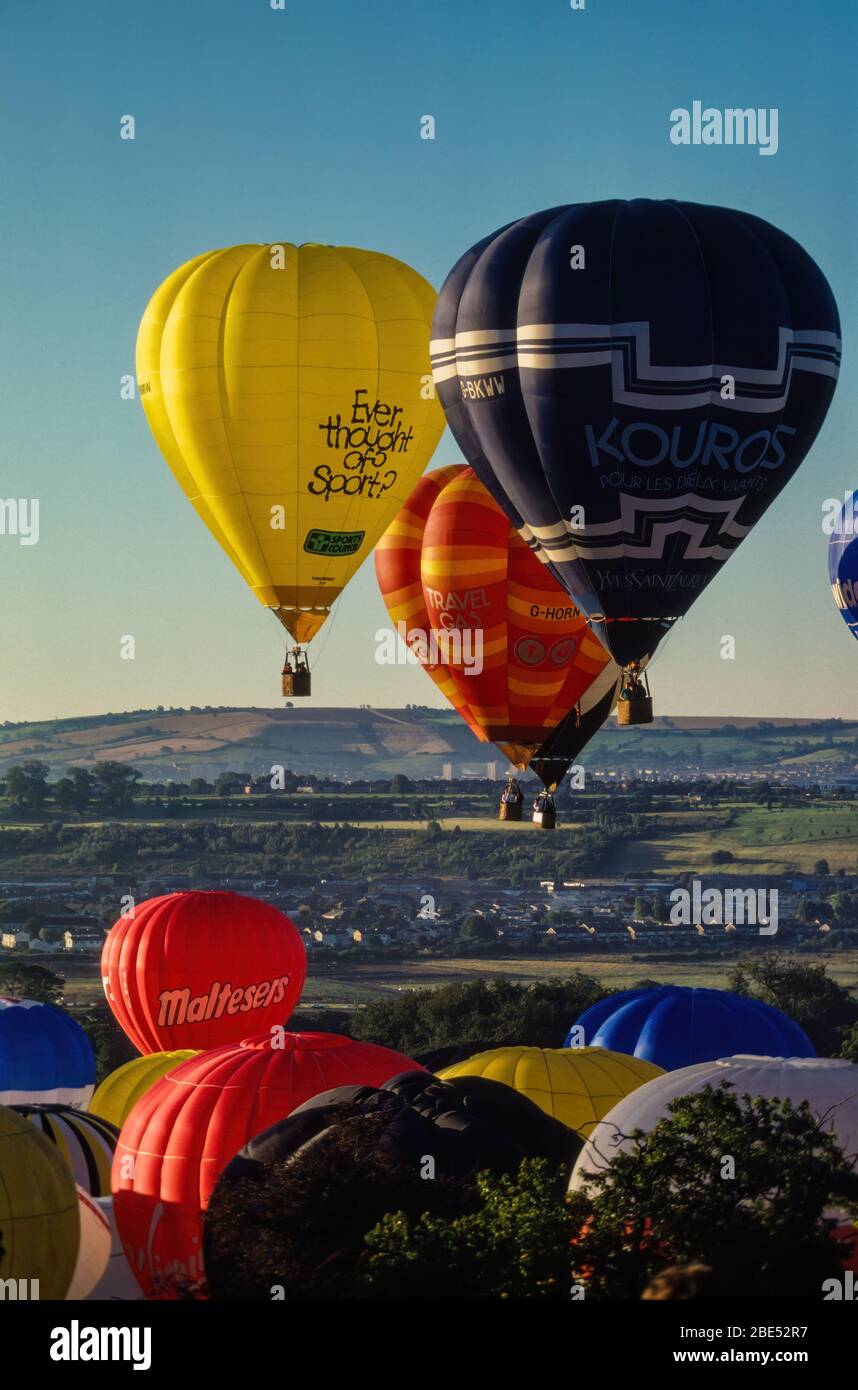 Early morning mass ascent of colourful hot air balloons at the Bristol