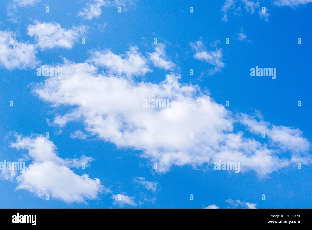 Fluffy white clouds on a sunny day. Stock Photo