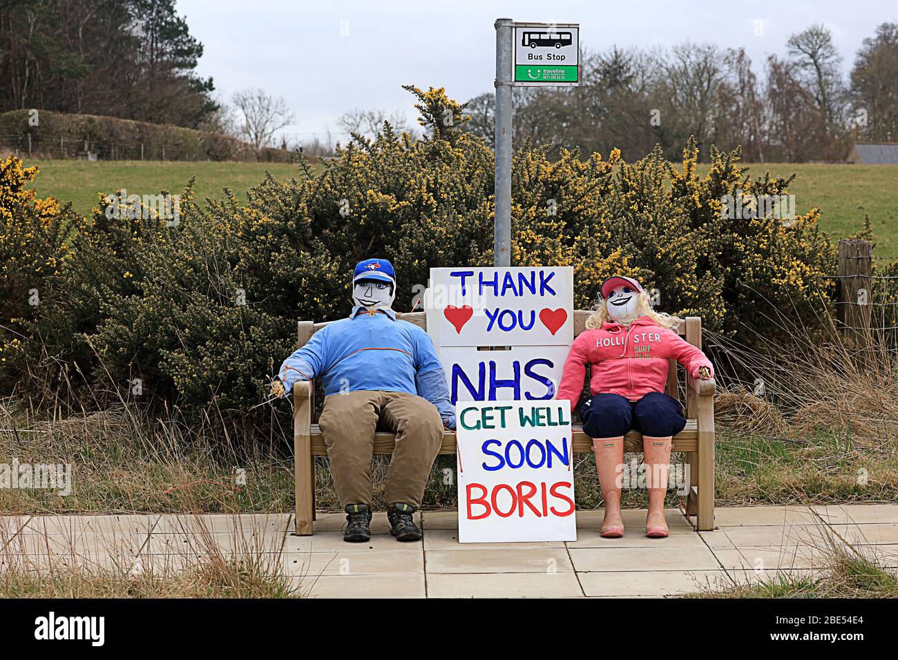Dummies on bench saying thank you to the NHS Stock Photo