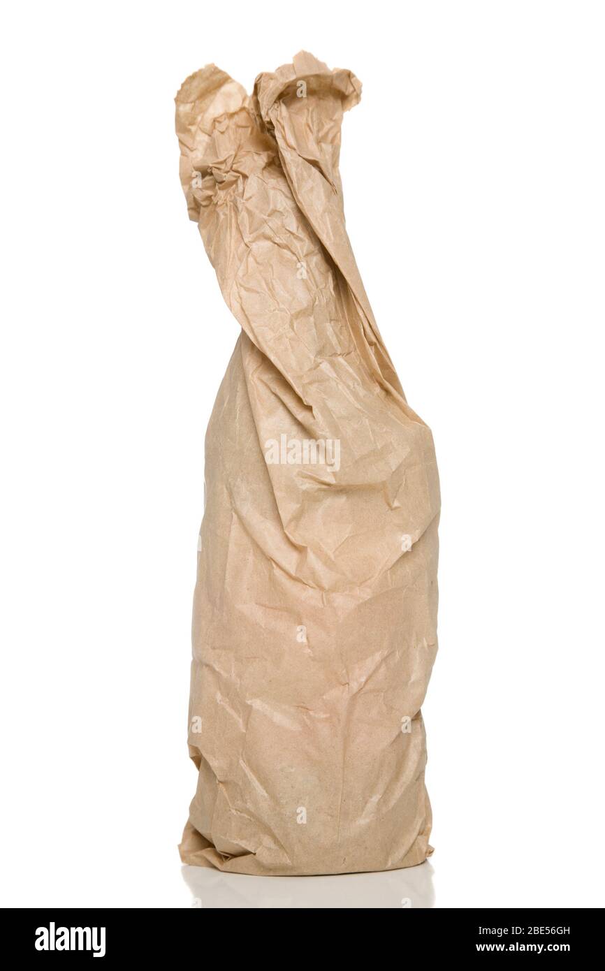 A bottle in a brown paper bag. Stock Photo