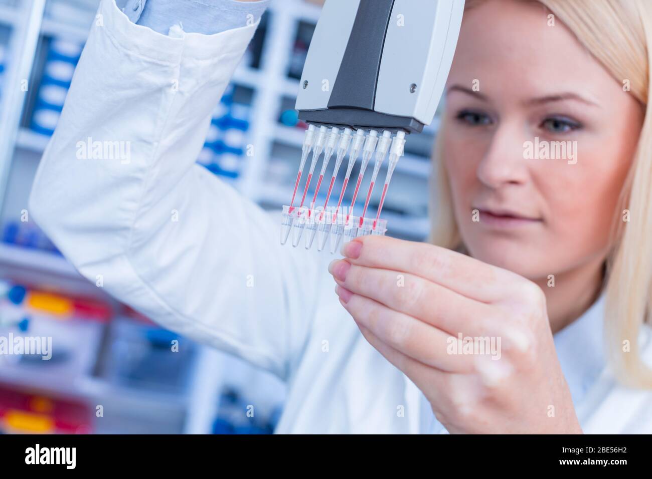 Girl laboratory Assistant works with an antiviral drug in a