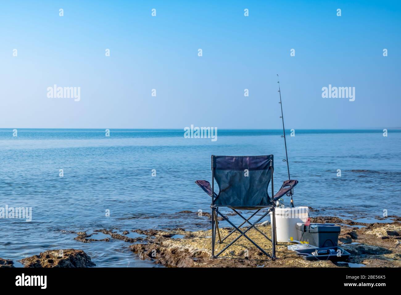beach chair and fishing pole on beach Chair fishing rod on beach hi-res stock photography and images