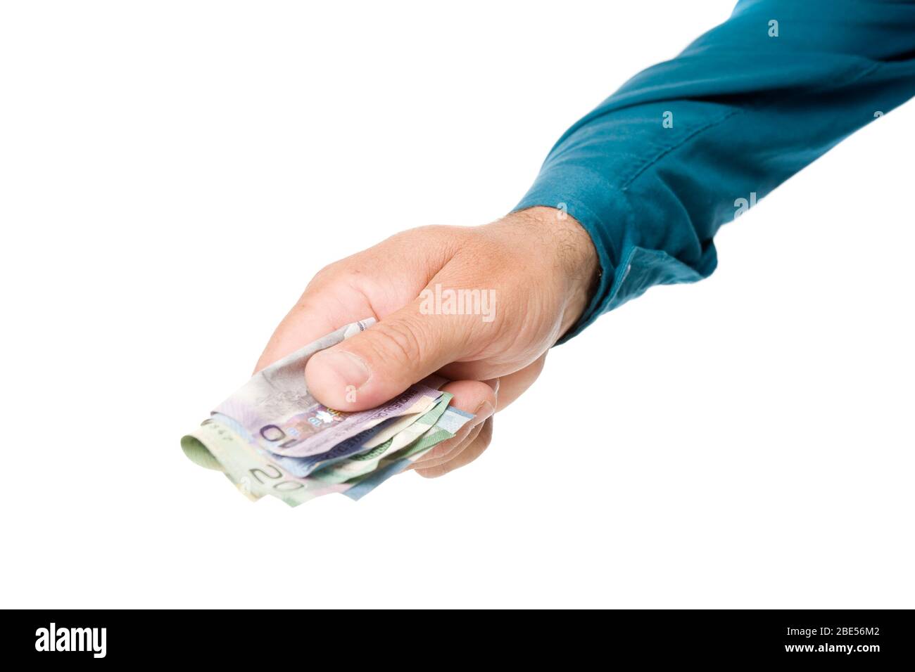A hand extended out to give money, on white. Stock Photo