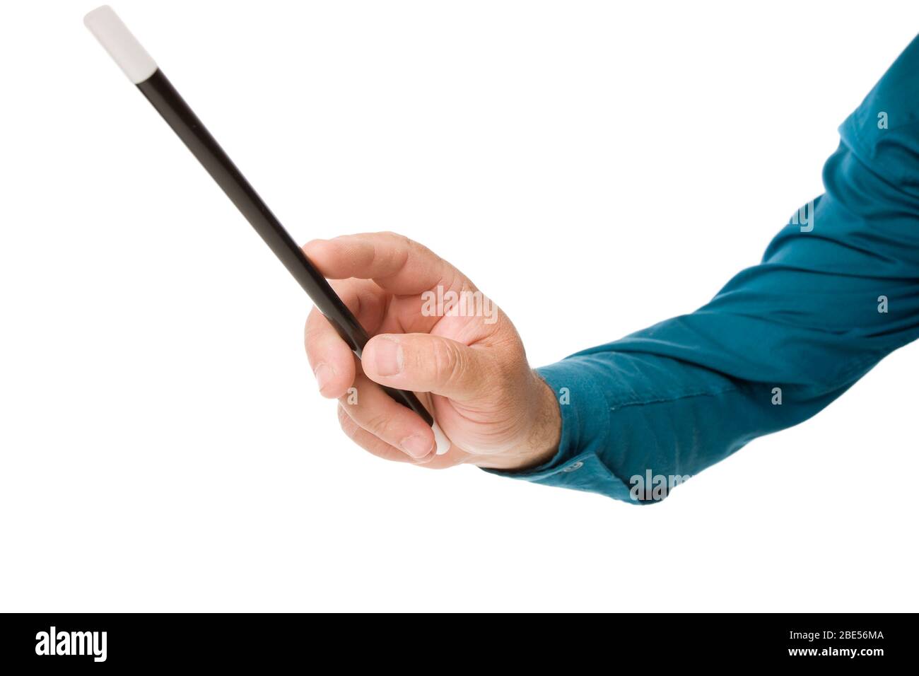 A close up of an arm waving a magic wand. Stock Photo