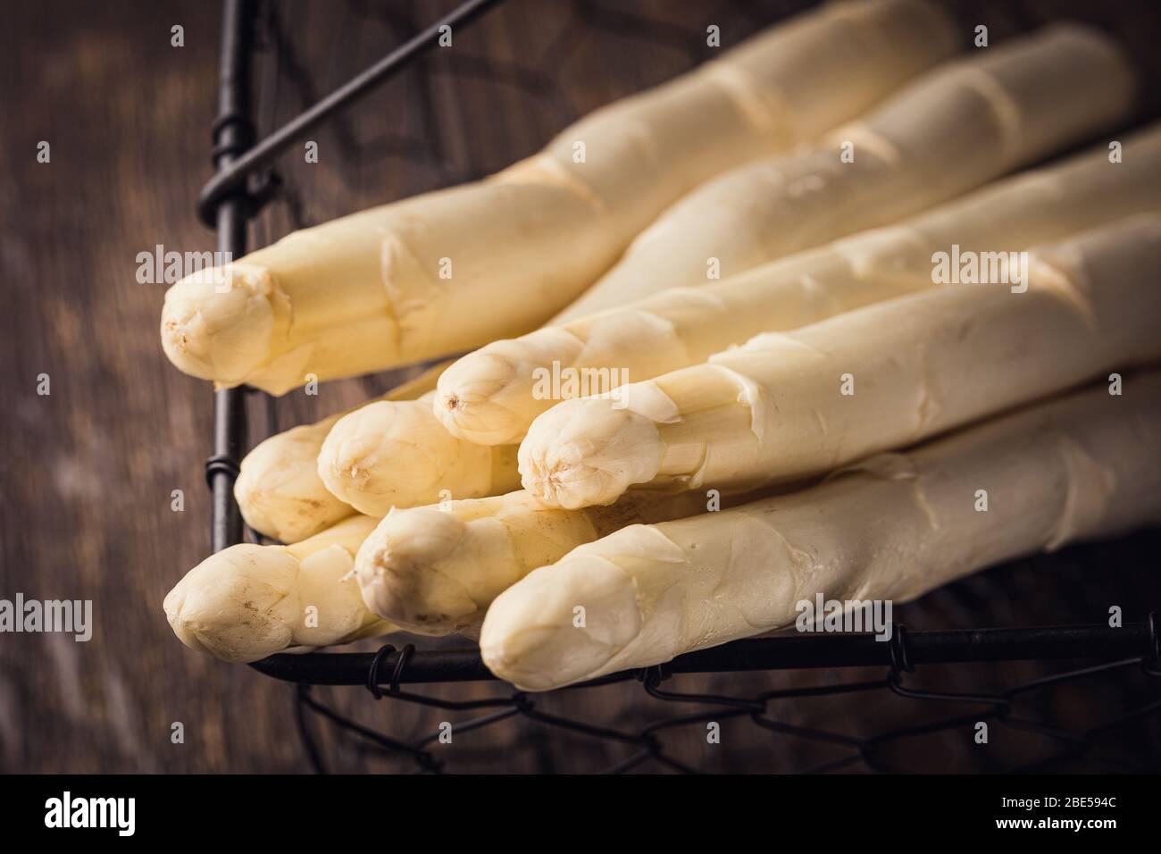 White asparagus on wooden table Stock Photo