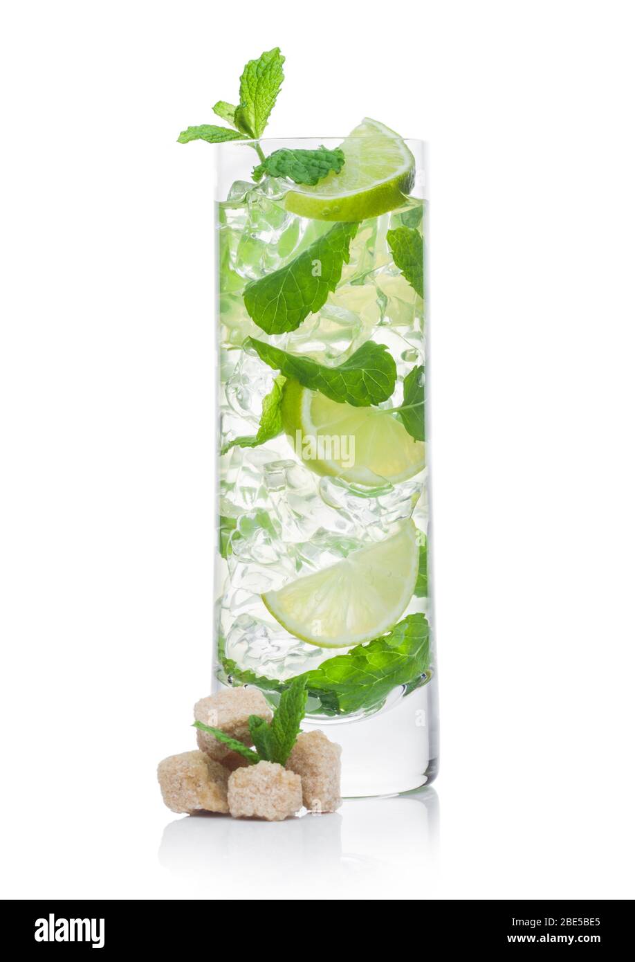 Highball glass of Mojito summer alcoholic cocktail with ice cubes mint