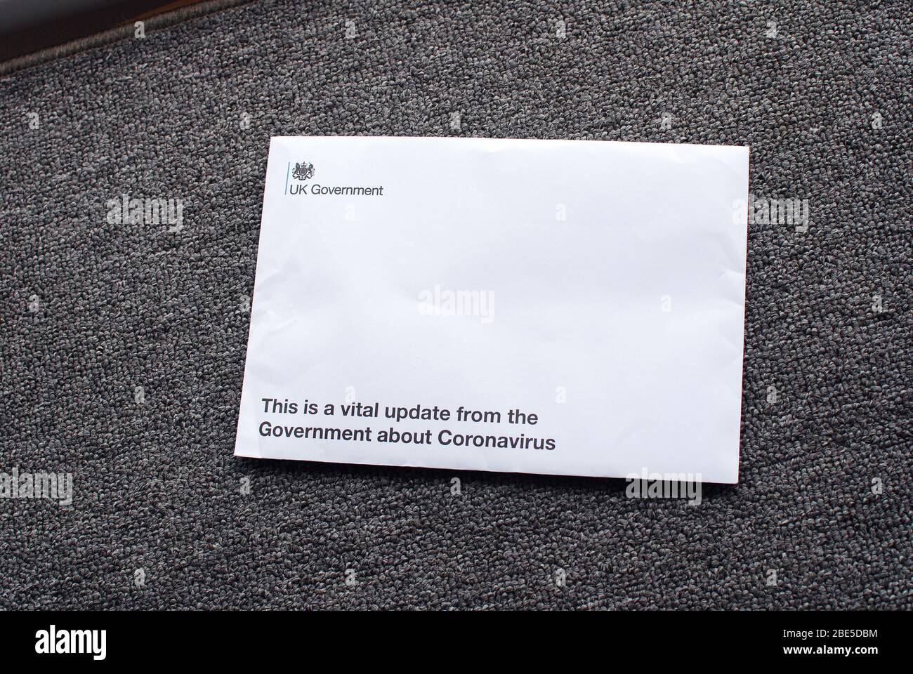 A letter from the UK Government giving advice about the Coronavirus pandemic on a hallway doormat. Stock Photo