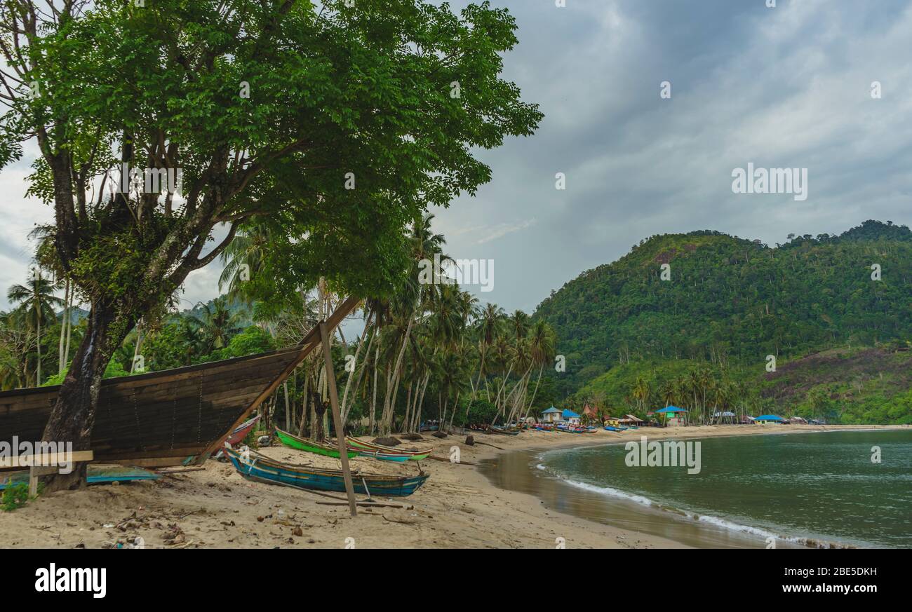 Fishing village scene with many traditional wooden baots by the beach Sungai Pinang, West Sumatra Stock Photo