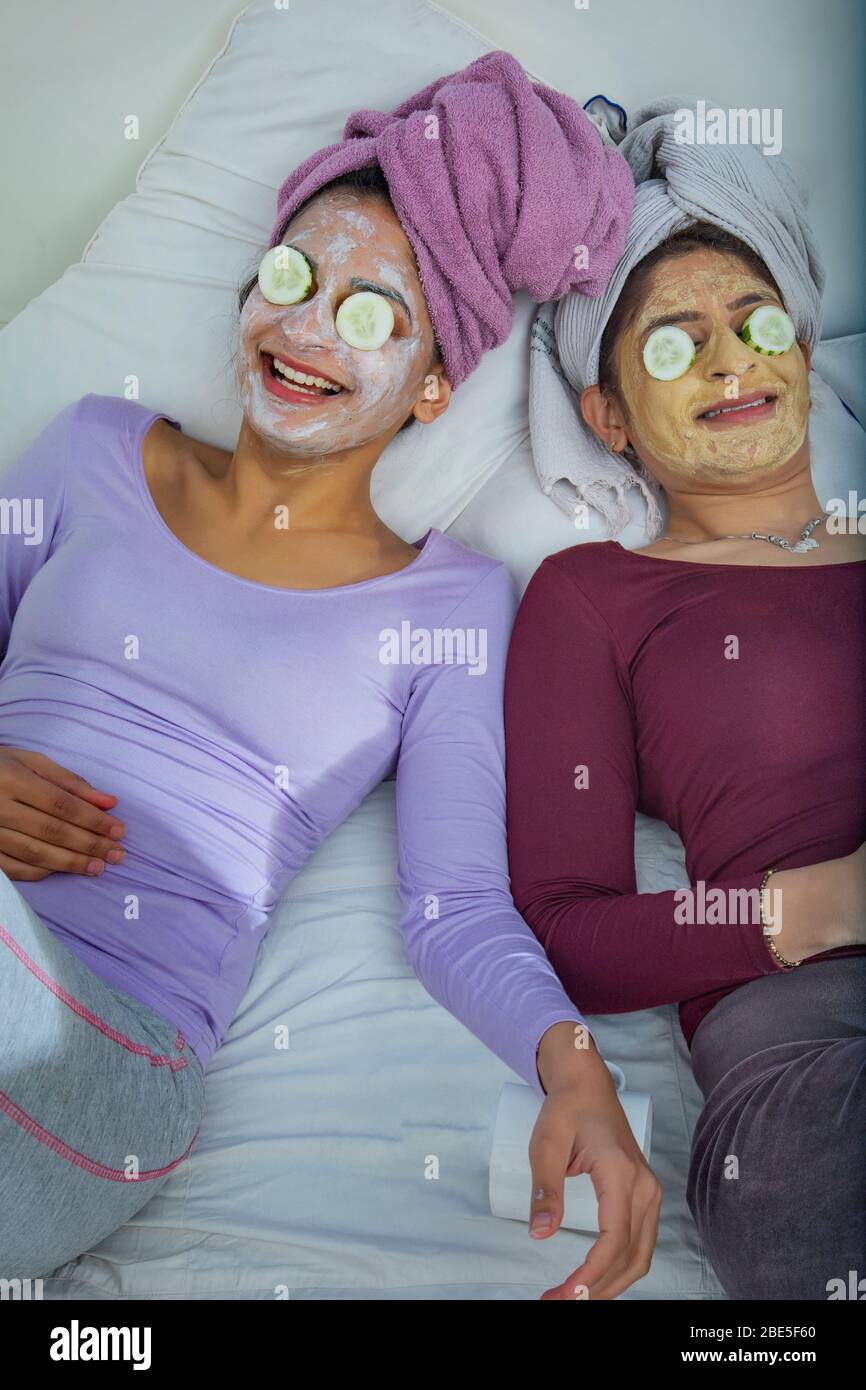 Two sisters doing a skin care routine together at home Stock Photo Alamy