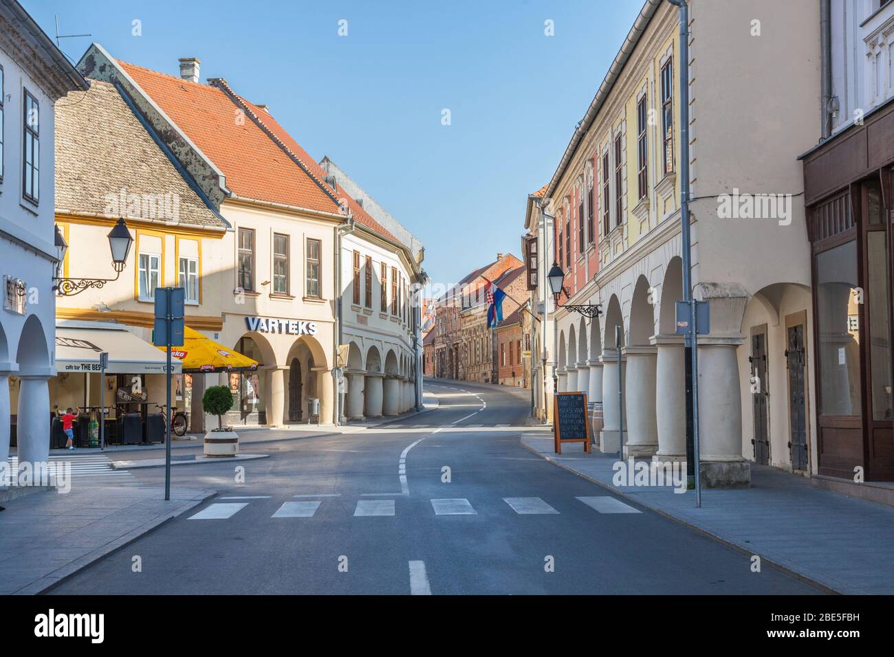 VUKOVAR, CROATIA - AUGUST 25, 2018: Franjo Tudjman street, the main street of the Slavonia city of Vukovar, in northern Croatia, with its iconic old b Stock Photo