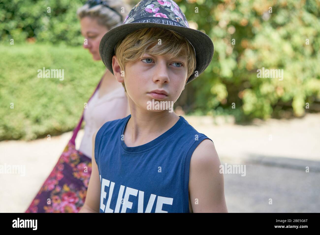 Boy misunderstood by his mother looking unhappy and sad Stock Photo