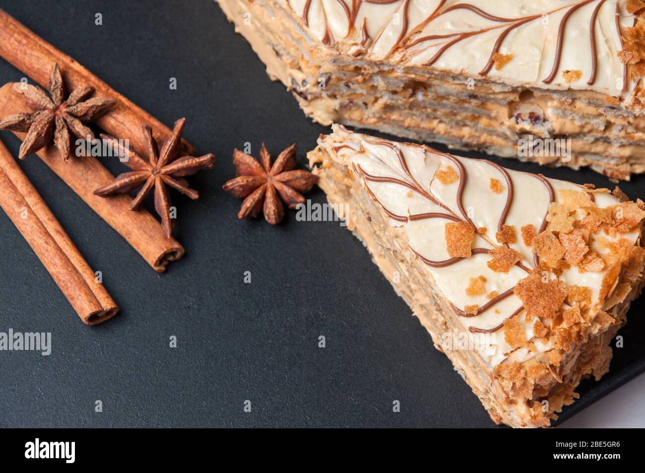 Board with delicious caramel cake on table Stock Photo