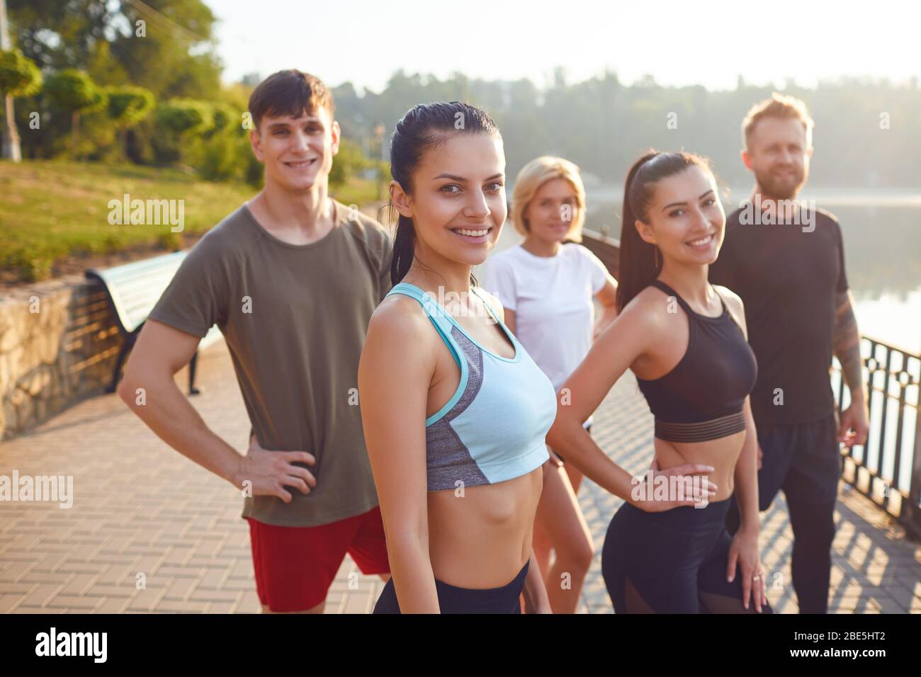 A group of sporty people training in the park. Stock Photo