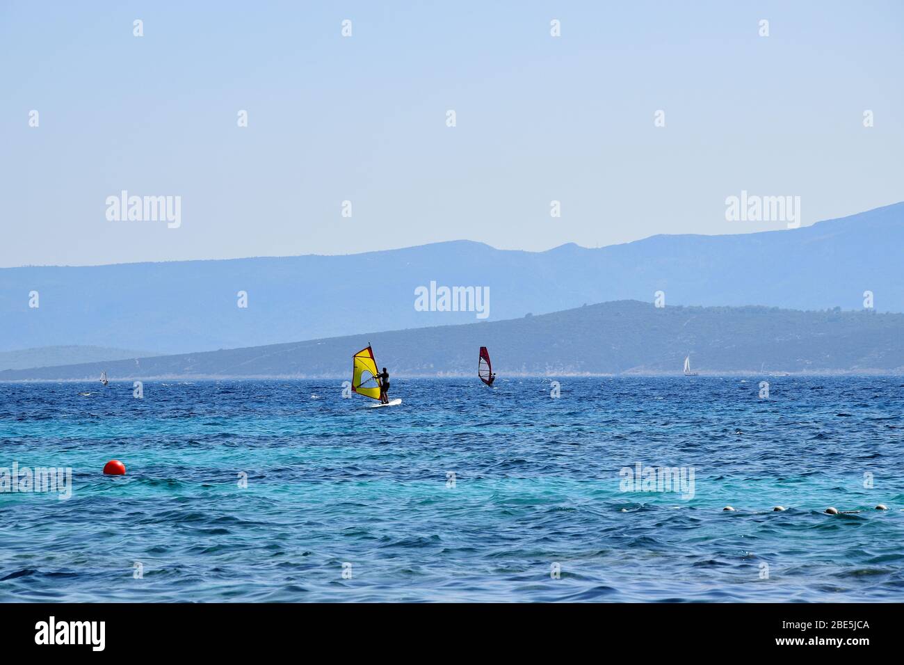 People are having an active pastime on vacation. Surfing on an Adriatic sea in Croatia. Stock Photo