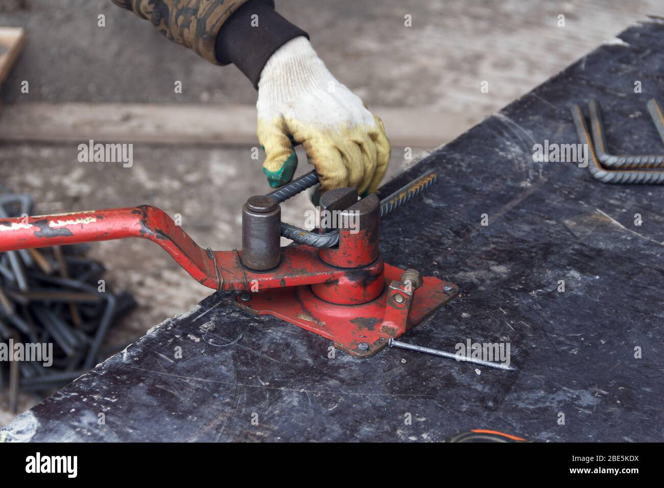 Bending reinforcement metal rebar. Worker using bending rebar machine for reinforcement in the
