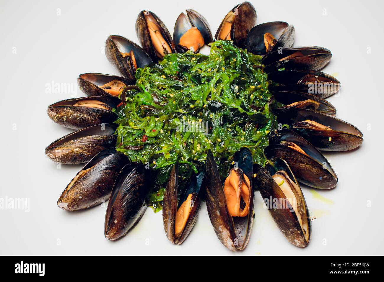 Green Chuka Seaweed Salad Top View. Wakame Sea Kelp mussels Stock Photo