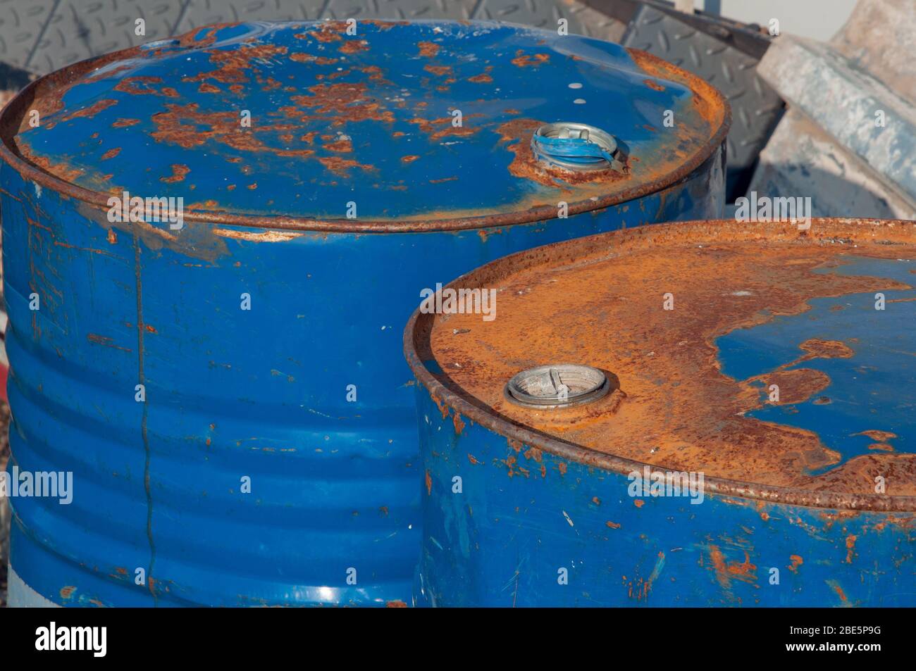 Old metal barrels from under engine oil. Barrels for storing industrial