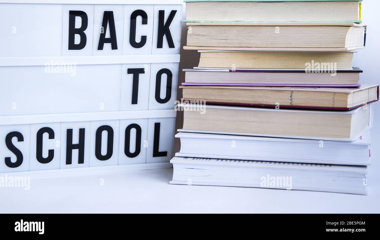 lightbox with BACK TO SCHOOL text and books on white background Stock Photo