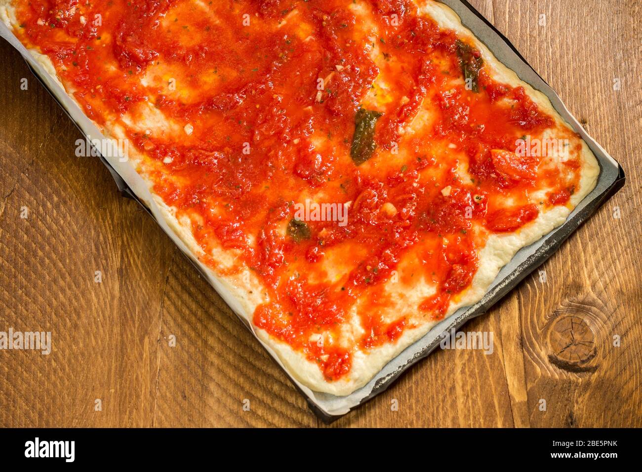 Vegan tomato pizza pan without cheese ready to bake in the home wood oven Stock Photo Alamy
