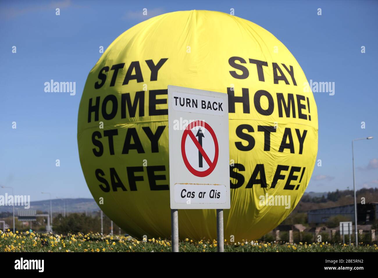 Naas, Leinster, Ireland, 11/March/2020. Covid-19 art sculpture screams Stay Home, Stay Safe, as Ireland enters its 15th day of Lockdown and faces three more weeks of staying indoors.  A Stay Home - Stay Safe message on the famous Naas Ball art sculpture, on the N7/M7 Motorway in County Kildare. Photo: Sasko Lazarov/RollingNews. Credit: RollingNews.ie/Alamy Live News Stock Photo