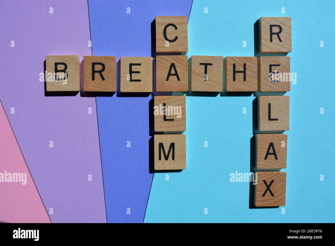 Calm, Breathe, Relax, crossword on colorful background Stock Photo