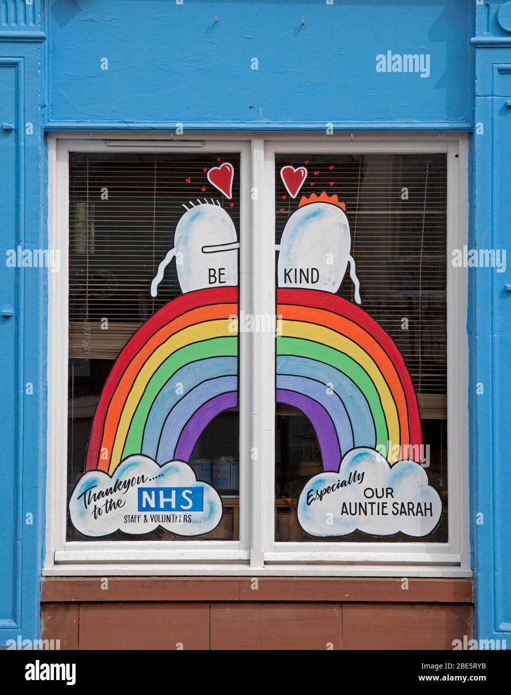 Portobello, Edinburgh, Scotland, UK. 12th April 2020. Hazy with occasional sunshine  at the seaside. Exceptionally quiet on Promenade and beach early afternoon on Easter Sunday due to the public staying at home because of the Coronavirus Lockdown, which enters fourth week. Sign in window thanking the NHS. Stock Photo