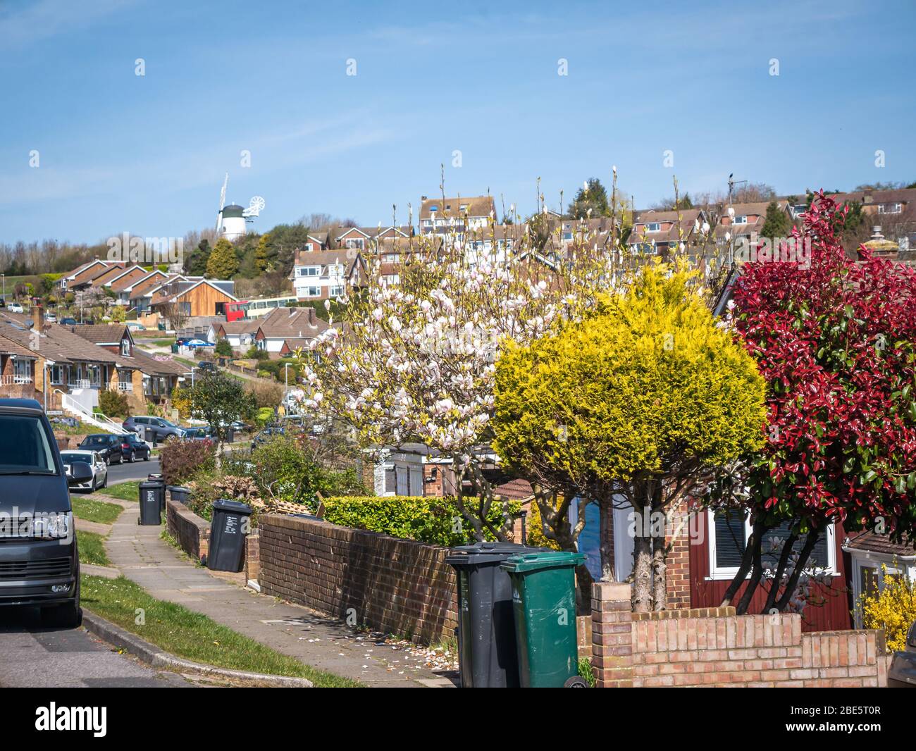 View along a street in spring time in the city suburbs Stock Photo