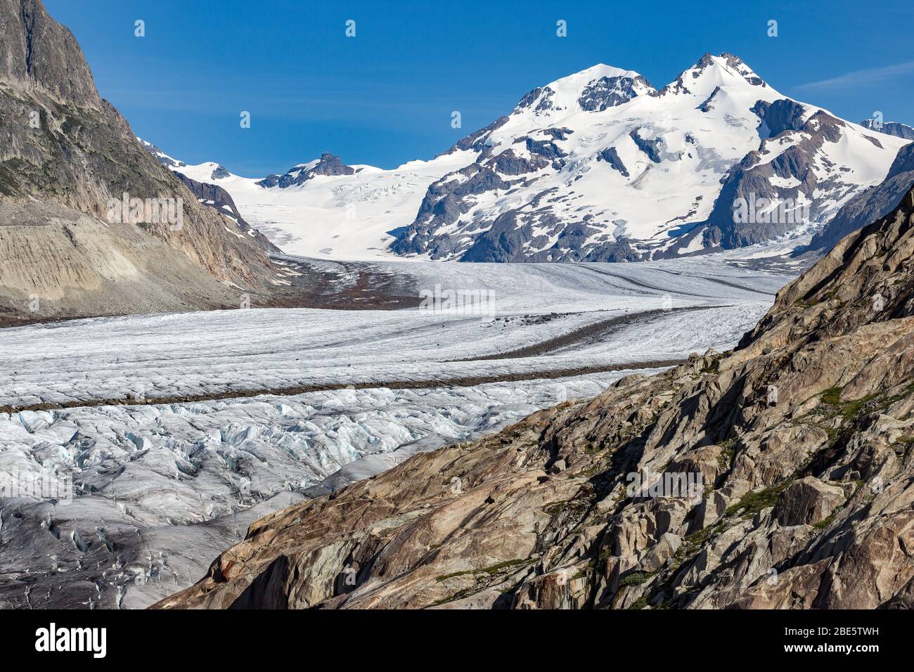 The Aletsch Glacier. Aletschgletscher. Smooth rocks. Mönch peak,  Eastern Bernese Alps in the Swiss canton of Valais. Switzerland. Stock Photo