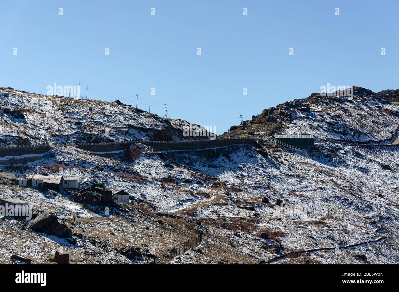 View of the snow sprinkled Nathu La Mountain Pass landscape during December at Sikkim, India Stock Photo