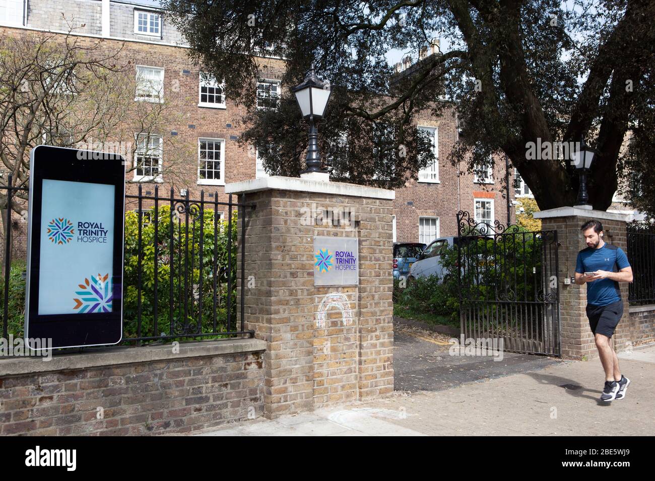 London, UK, 12 April 2020: Royal Trinity Hospice in Clapham, south London, has signs displaying corona virus information and appeals for financial support. With all their chairty shops closed and other revenue streams such as open gardens and sponsored walks not allowed, charities face severe short-falls in their fundraising because of the coronavirus. Anna Watson/Alamy Live News Stock Photo