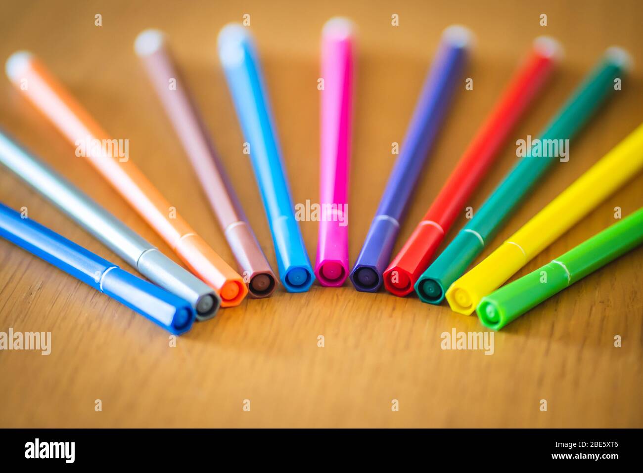 Colorful Set of Hema 12x2mm Writing Pens on a Wooden Desk Stock Photo -  Alamy