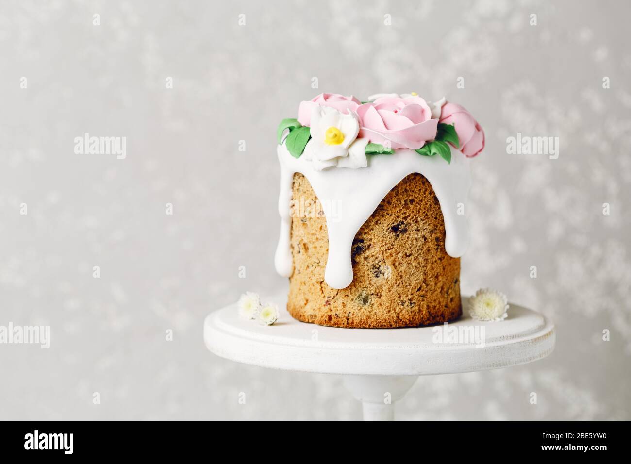 Easter cake on the stand on grey background. Holiday background, copy space Stock Photo