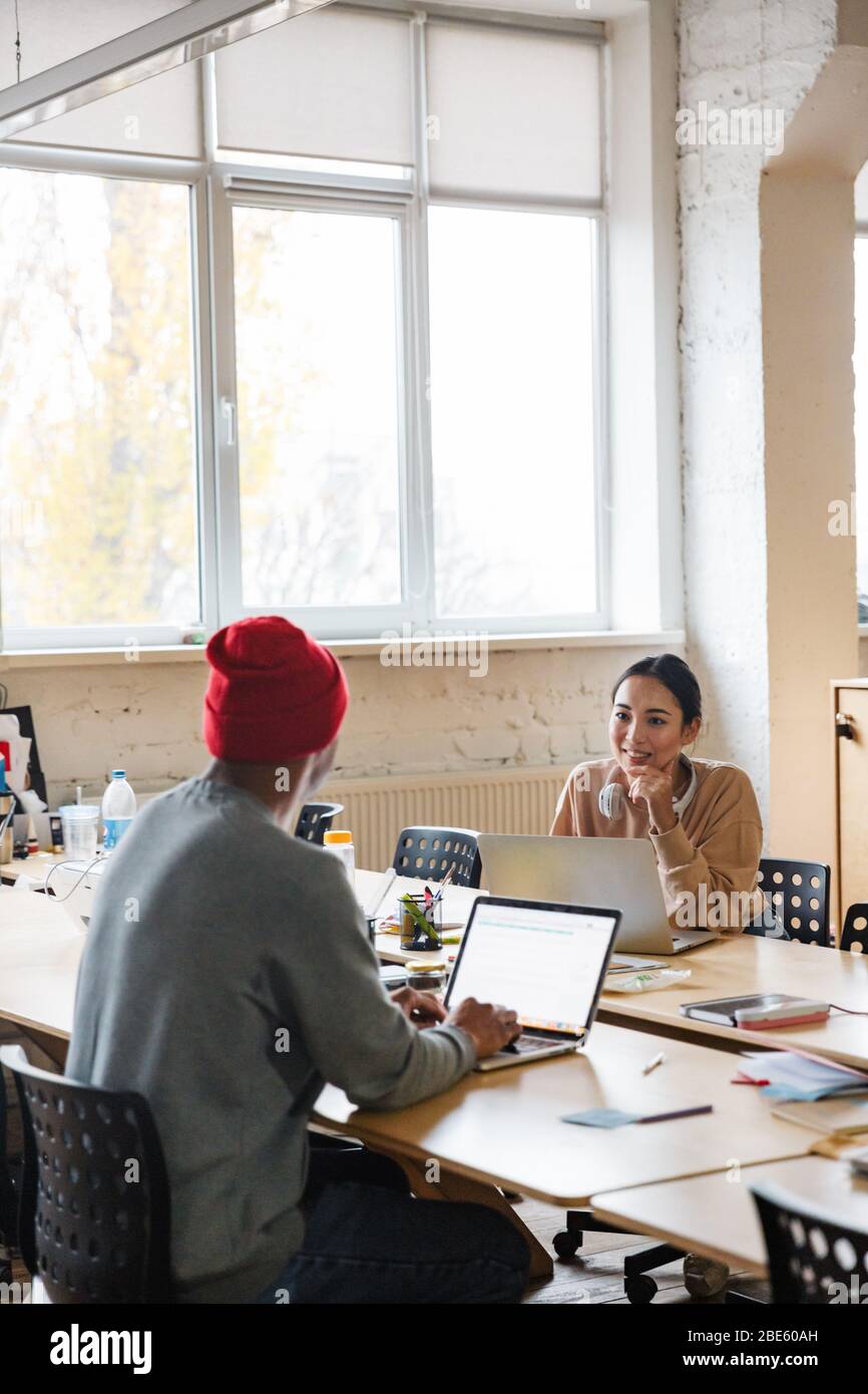 Image of a young concentrated multiracial colleagues indoors work in ...