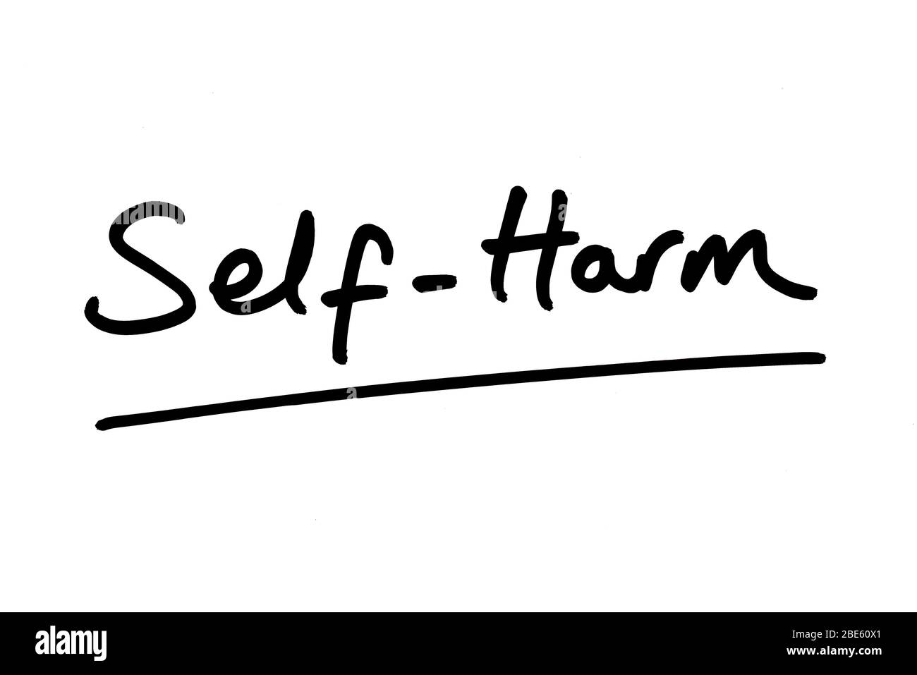 Self-Harm handwritten on a white background. Stock Photo